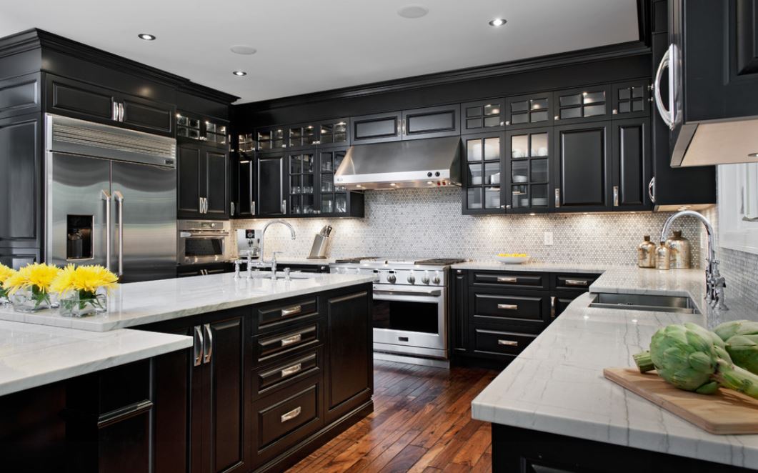 black cabinets and stainless-steel appliances